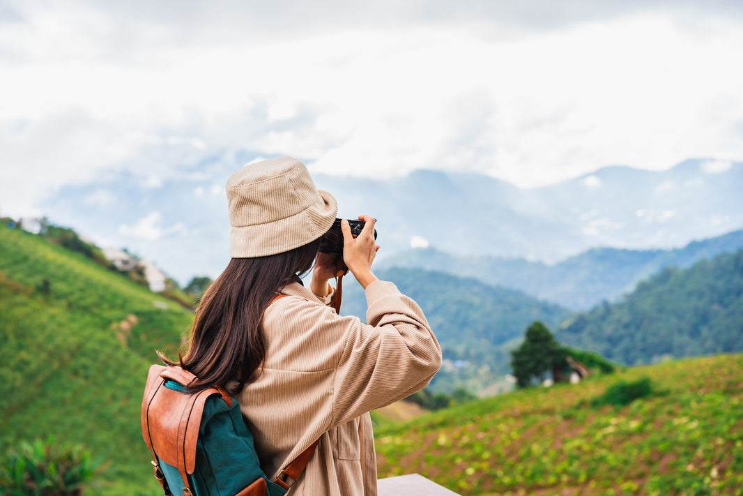 young-woman-traveler-taking-a-beautiful-landscape-2023-11-27-05-25-49-utc.jpg__PID:b6513da4-3693-4c34-b398-51c704a39c46